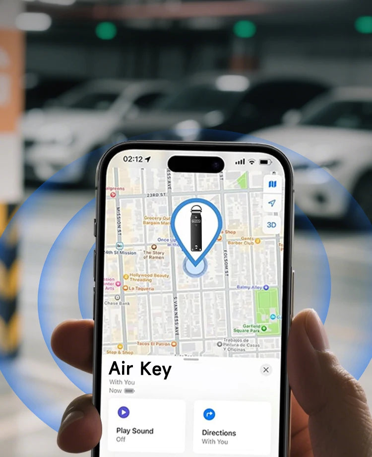 Hand holding an iPhone showing the Apple Find My app with the NURVION keychain's location pin in a parking area, and Play Sound and Directions options