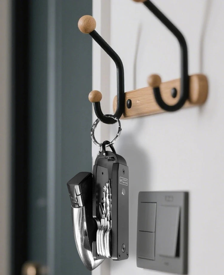 NURVION keychain with keys hanging on a wall hook rack by the front door
